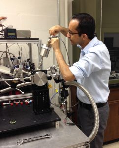 Hossein Salami working on the NASA-sponsored atomic layer deposition reactor system in the Semiconductor Material Processing Laboratory.
