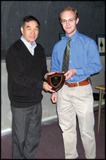 Professor Zhang is presented with his Faculty Appreciation Award by Pi Tau Sigma President Michael Lochner.