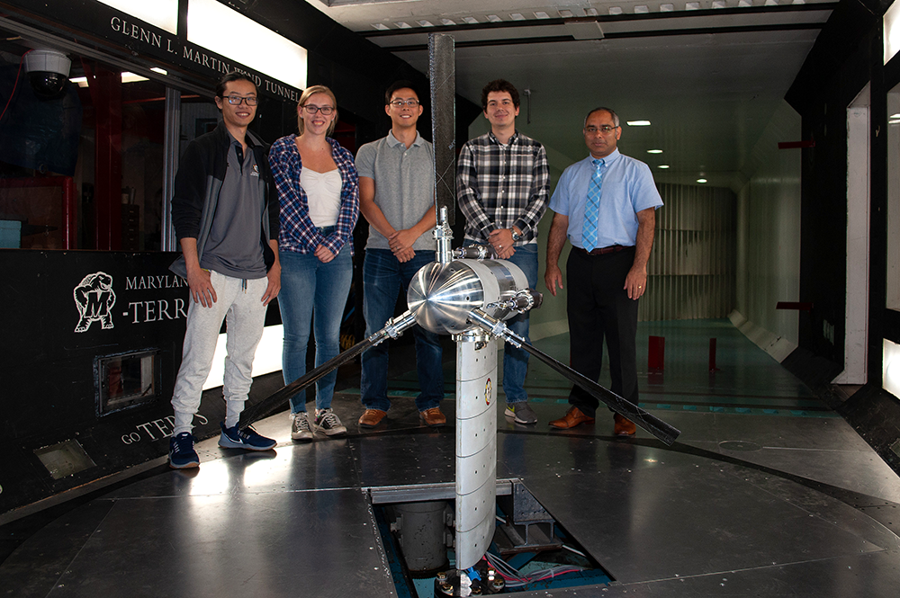 Dr. Anubhav Datta (far right) and students with the Maryland Tiltrotor Rig (MTR) inside of the Glenn L. Martin Wind Tunnel. The MTR is used to facilitate eVTOL and other research.