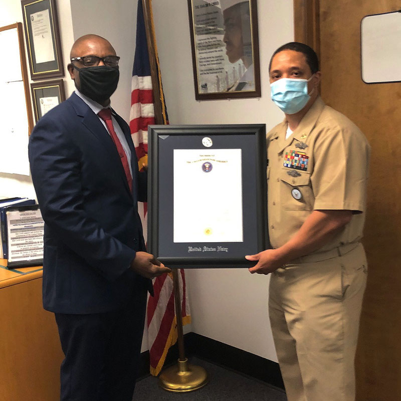 Alumni David Mayo (Ph.D. '14), pictured left, during his U.S. Navy commissioning ceremony, July 2020, as part of the Direct Commission Officer Program.