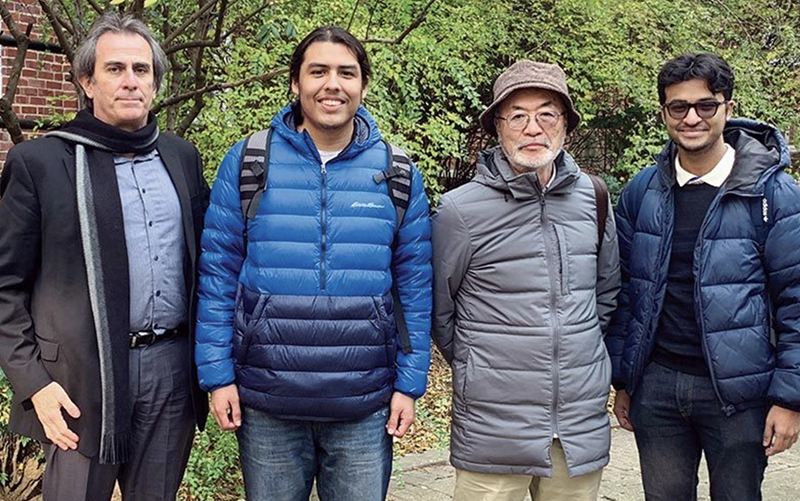 From left, UMD Professor Richard Marciano, Isaac Hernandez ’24, Haruo Kawate and Akif Zaman ’23 are pictured on campus. Hernandez and Zaman were part of a student team that researched the path of Kawate’s father in World War II-era Japanese camps. (Photo courtesy of Richard Marciano, via Maryland Today)
