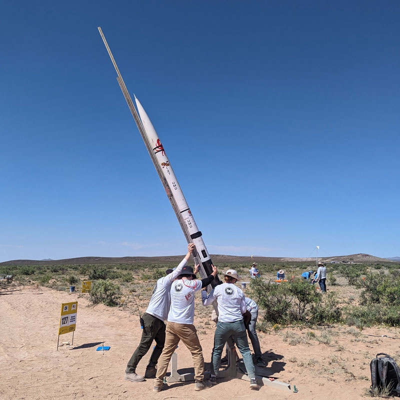 Students setting up their rocket, 'Karkinos,' in the New Mexico desert.