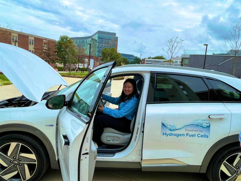 Alex Lam, UMD Materials Science undergraduate, gets a first-hand look at the DOE hydrogen fuel cell car. (Photo courtesy of Cathy Stephens, MEI2)
