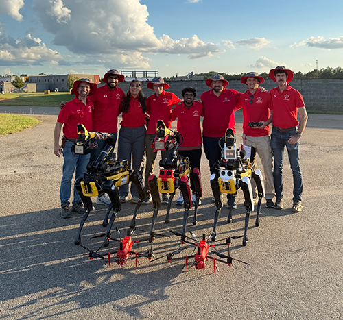 From left: Professor Derek Paley (aerospace engineering), Srijal Poojari (Ph.D. candidate, electrical and computer engineering), Assistant Research Professor Kleio Baxevani (aerospace engineering), Zachary Bortoff (Ph.D. candidate, aerospace engineering), Vivek Mange (Faculty Specialist, aerospace engineering), Rob Neuner (Operations Director, UMD UAS Research and Operations Center), Chris Titus (Engineer, UMD UAS Research and Operations Center), Josh Gaus (Lead UAS Engineer, UMD UAS Research and Operations Center).