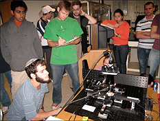 Students engaged in biaxial micro-tensile testing of a thin film specimen during an undergraduate materials science course held in new Modern Engineering Materials Instructional Laboratory (MEMIL).