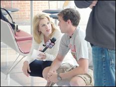 Fox 5 reporter Holly Morris interviews one of the students at the competition.