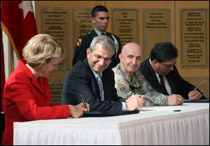 The CRADA Statement of Work document is signed by Dr. Norma Allewell, Acting Vice President of Research, University of Maryland (far left); and Mr. Gary Blohm, Director, Communications‐Electronics Research, Development, and Engineering Center (far right). Moments earlier, University of Maryland Acting President and Provost Nariman Farvardin (second from left); and RDECOM Commanding General, Major General Nick Justice (third from left) signed the CRADA agreement.