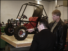 Dr. Vahdati ( left ) and Dr. Schultz at the SAE lab in front of the 2007 Mini-Baja car
