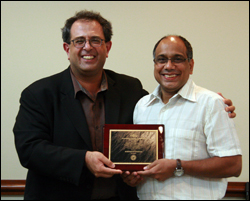 ISR Director Reza Ghodssi (L) congratulates Professor S. 