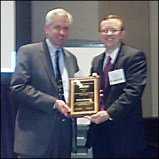 BioE Professor and Chair William E. Bentley (left) receiving his award at the AIChE conference.