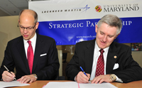 UMD VP and Chief Research Officer Patrick O'Shea (right), and Lockheed Martin Senior VP and Chief Technology Officer Ray O. Johnson (left) sign a master research agreement.