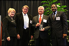 Pictured, from left to right: MIPS Director Martha Connolly; Dr. John Baras, Lockheed Martin Chair in Systems Engineering and Professor, Department of Electrical and Computer Engineering and Institute for Systems Research at the University of Maryland; John Kenyon, Senior Vice President for Engineering, Hughes Network Systems, and Clark School Dean Darryll Pines.