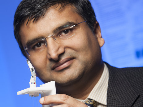 Prof. Jaydev Desai and the Minimally Invasive Neurosurgical Intracranial Robot (NIMIR) prototype.