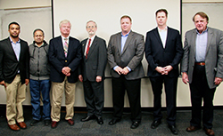 Dr. Baras (at right) with the distinguished panel of judges.