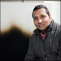 Ph.D. candidate Ajay V. Singh with the results of a vertical wall test that shows the effects of a burning fuel's temperature gradient.