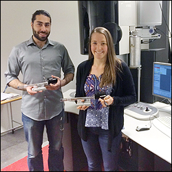 Voskanian (left) and Nilsson (right) in the Titan TEM facility at Chalmers University, with two of the many sample holders that the Eva Olsson Group uses.