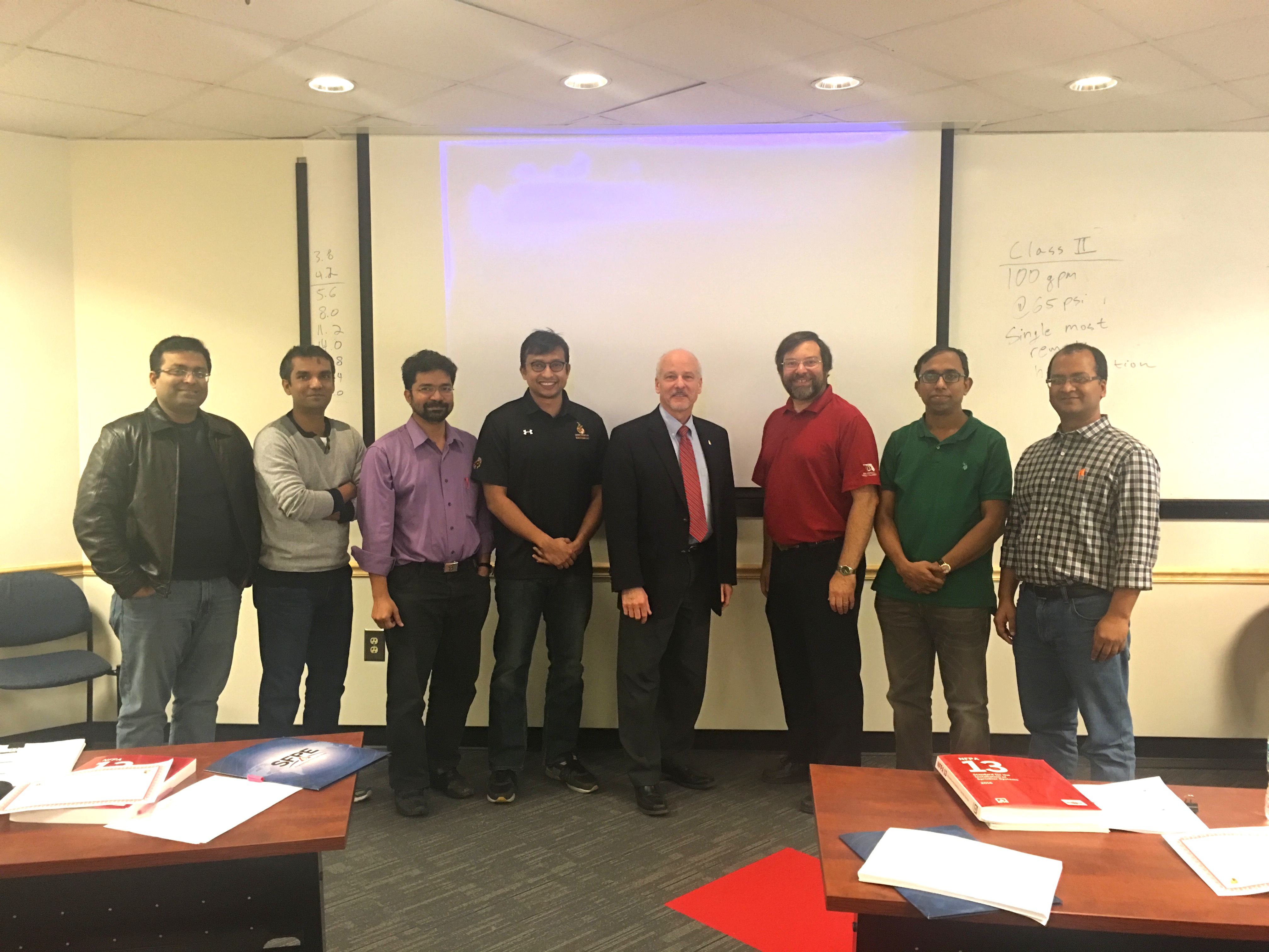 Image: Jim Milke (center), Kenneth Isman (right of Milke), Tanvir Manzur (left of Milke) and the rest of the BUET engineers.