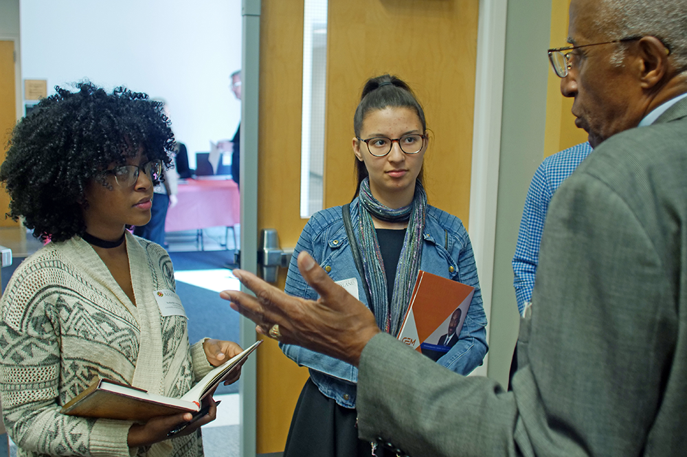 Students talk with Howard G. Adams, former GEM executive director, at the GEM GRAD Lab.