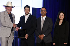 ASHRAE President Bjarne Olsen presents the award to Dr. Daniel Bacellar, Dr. Vikrant Aute, and Dr. Zhiwei ‘Joy’ Huang during the society’s annual conference held in Houston in June.  ASHRAE photo by Krys Gilstrap.