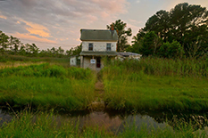 An abandoned home on the Deal Island Peninsula of Maryland's Eastern Shore sits in an area that floods frequently.(Photo by John T. Consoli)