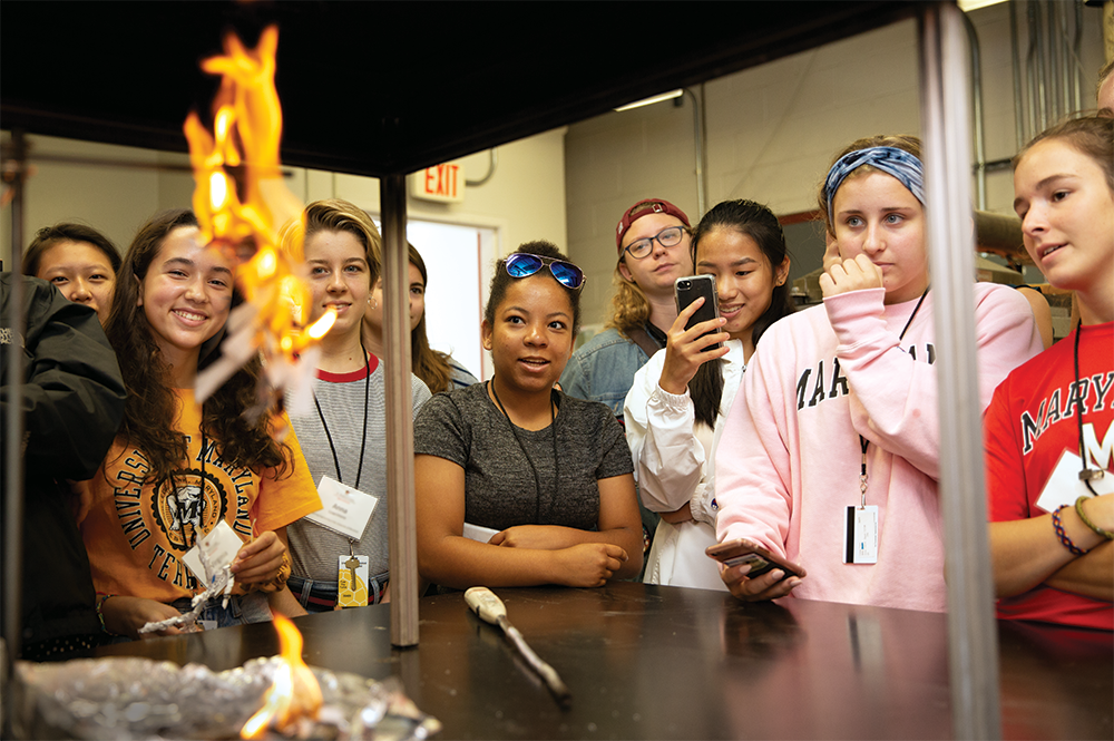 High school students in a WIE summer program get up close to a fire whirl. Photo: Matthew Ehrichs