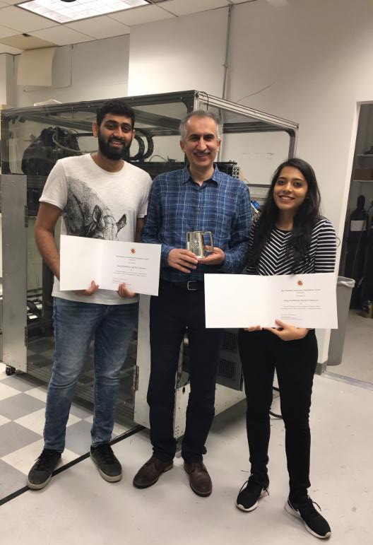 Best student presentation award winners, Sai Vathsavai (left) and Gargi Kailkhura (right), with Research Professor Amir Shooshtari