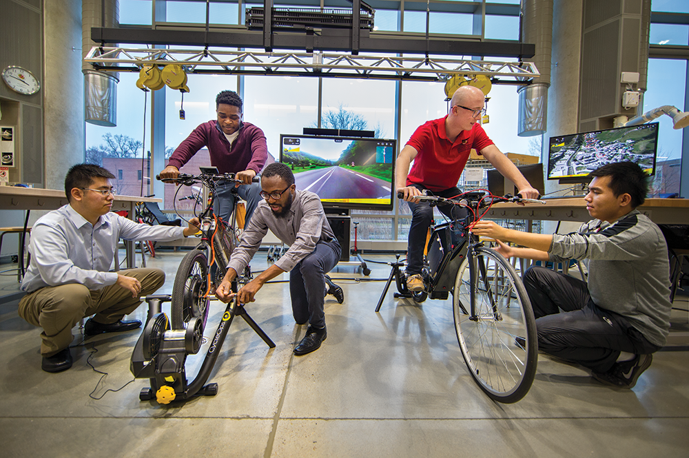 Student teams test their e-bikes on indoor trainers. Photo: John T. Consoli