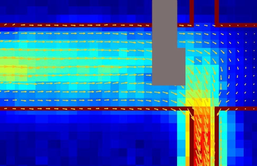 A picture of an electrical current in graphene (marked by the red outline) showing a fluid-like flow imaged using a diamond-based quantum sensor. The grey portion is where the metal electrical contacts prevented collection of data. (Walsworth and Yacoby research groups, Harvard and University of Maryland)