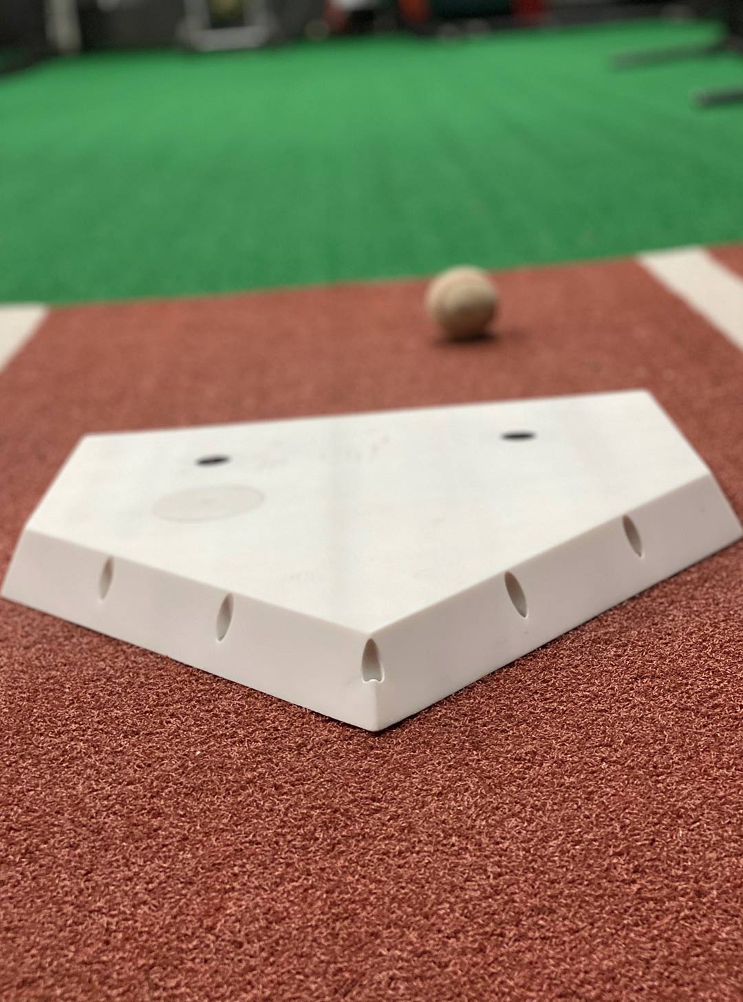 The camera from Plate Vision, the electronic home plate (below) developed by UMD researchers John R. Rzasa and Christopher C. Davis and CEO Todd Levitt, captures a bat striking a ball for a hit. (GIF and photo courtesy of John R. Rzasa and Todd Levitt)