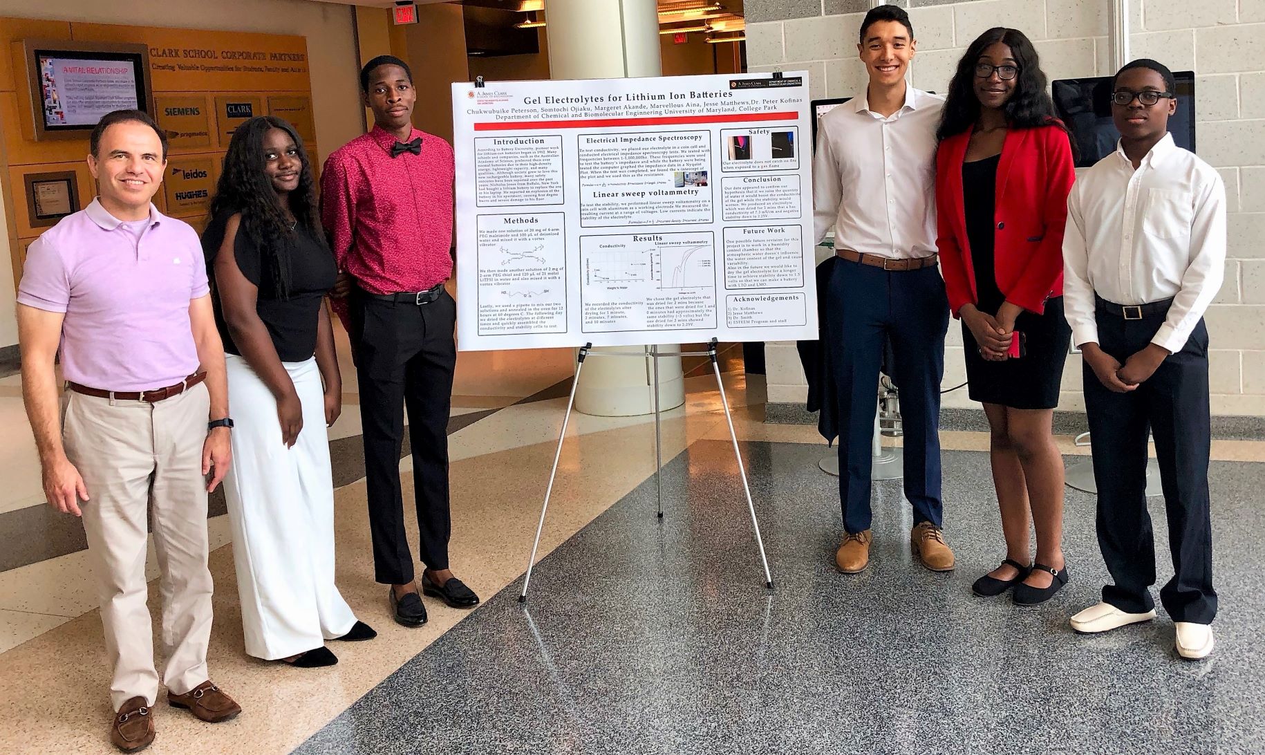 Image: Kofinas (far left) and Matthews (third from right) pictured during the 2019 program with high school students from the local area. Photo provided by J. Matthews.