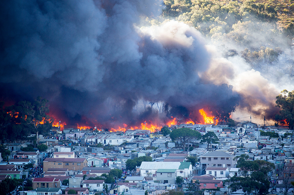 A fire engulfs an informal settlement in South Africa.
