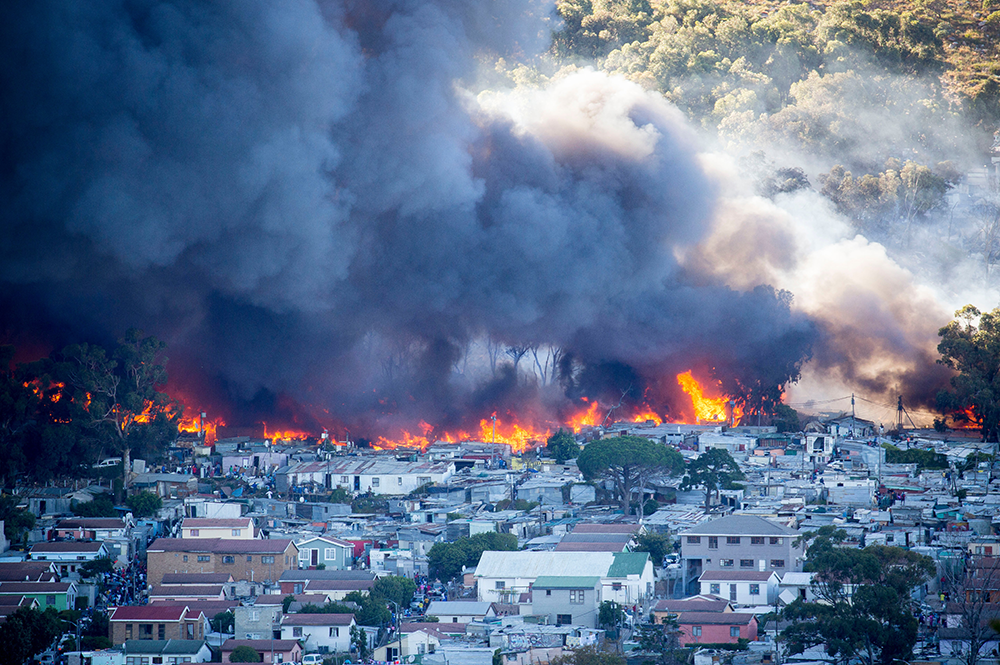 A massive blaze in early 2017 swept through an informal settlement in Cape Town, South Africa, leaving nearly 10,000 people homeless. A team of UMD students explored the factors leading to higher risk from fire in the developing world and proposed several affordable countermeasures. Photo: by Aletta Harrison/GroundUp