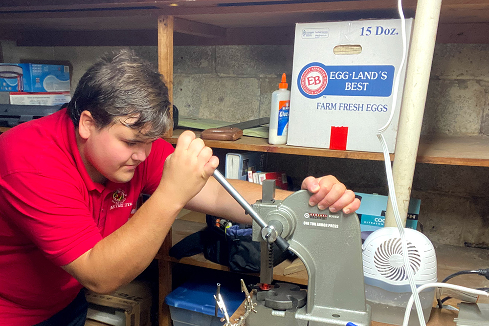 A photo of aerospace engineering student John McDonald, showing him at work on his project for the UMD UAS Test Site internship