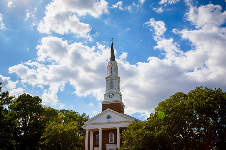 Memorial Chapel against a blue sky with white clouds