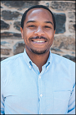 Dr. Gregg Duncan, pictured in front of a brick background.