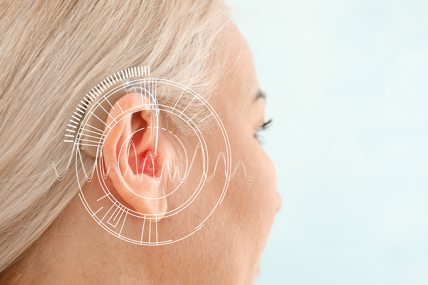 Woman with hearing aid and overlay of technical diagram