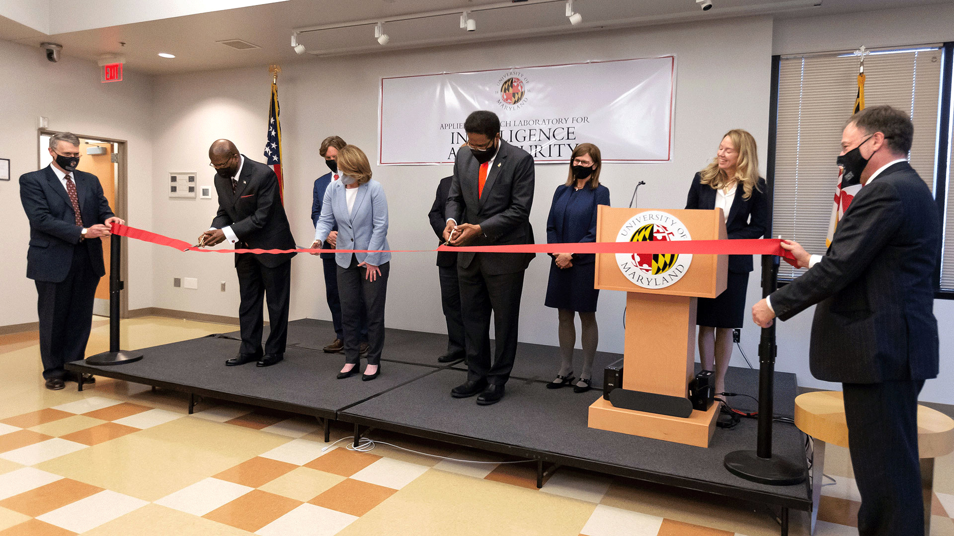 UMD President Darryll J. Pines (center) and Deputy Defense Secretary Kathleen Hicks M.P.M. '93 cut a ribbon at the official opening of facilities for the Applied Research Laboratory for Intelligence and Security (ARLIS). Ronald S. Moultrie, undersecretary of defense for intelligence and security (left), also helped cut the ribbon. 
 
Photo by John T. Consoli