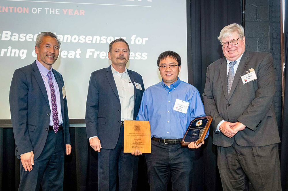 From left, Academy for Innovation and Entrepreneurship founder and UMD Interim Chief Innovation Officer Dean Chang; UM Ventures, College Park Director Ken Porter; Invention of the Year winner Assistant Professor Cheng Gong; and Vice President for Research Gregory F. Ball celebrate Tuesday at Innovate Maryland. Photo: Mike Morgan