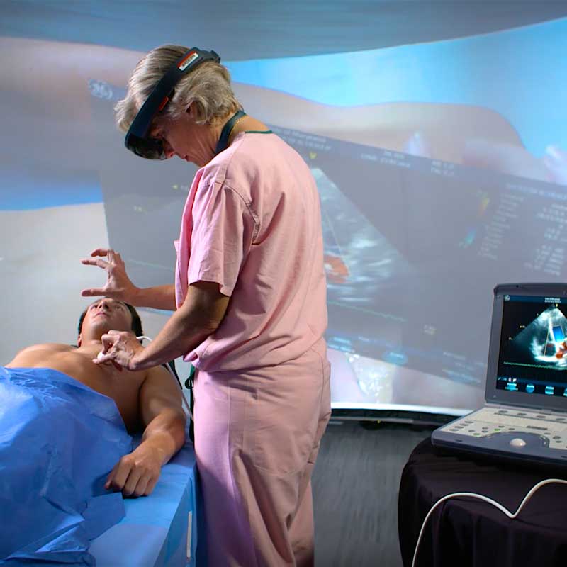 Dr. Sarah Murthi tests an augmented reality prototype that overlays ultrasound data directly on the patient. Photo courtesy of Maryland Blended Reality Center
