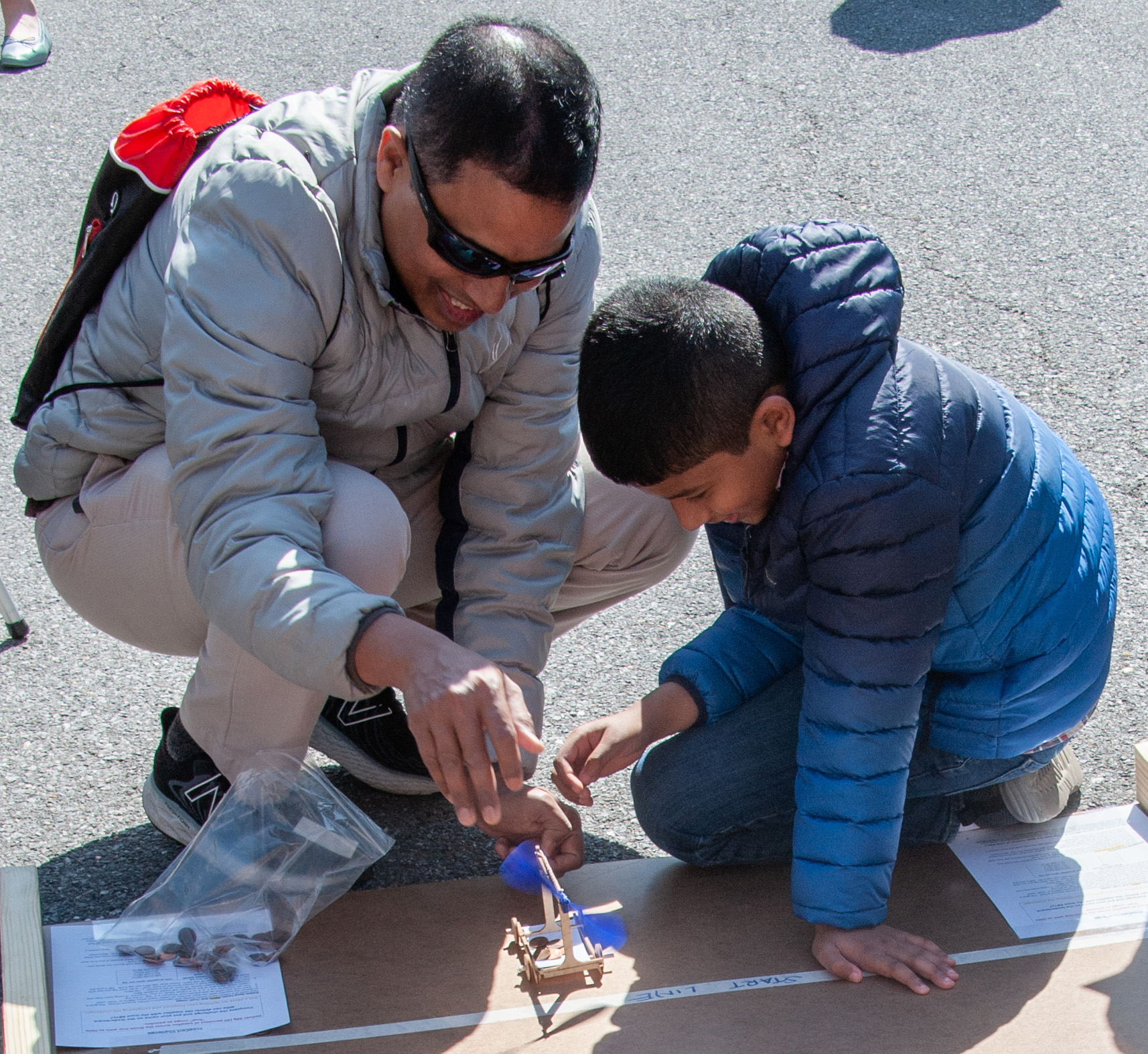  Praveen Konnuru and his child, Shriyans, experiment with GOALKits at Maryland Day in April 2022. 