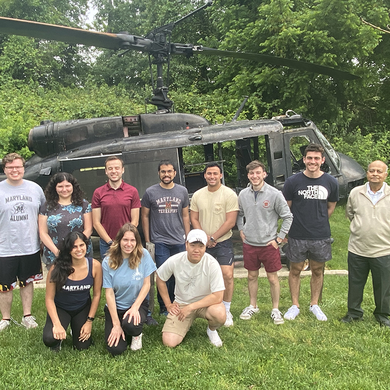 AE VFS Undergraduate team pictured with Dr. Nagaraj in front of a helicopter.