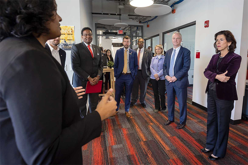 U.S. Secretary of Commerce Gina Raimondo listens to students in the IDEA Factory's Startup Shell during a tour of campus innovation spaces to highlight the need for domestic electronics manufacturing. Photo by Stephanie S. Cordle.