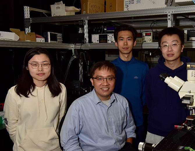 Photo in Gong lab. From left to right: Dr. Qinqin Wang, Prof. Cheng Gong, Zhihao Song, and Ti Xie.
