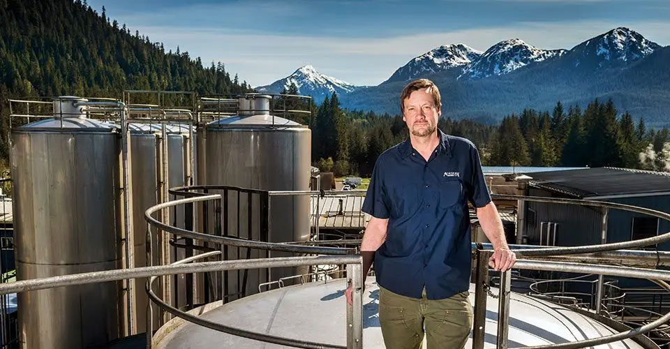 The craft beer that Geoff Larson ’80 produces for his Alaskan Brewing Company draws from the natural resources of Juneau. Photo by Chris Miller/Alaskan Brewing Co.