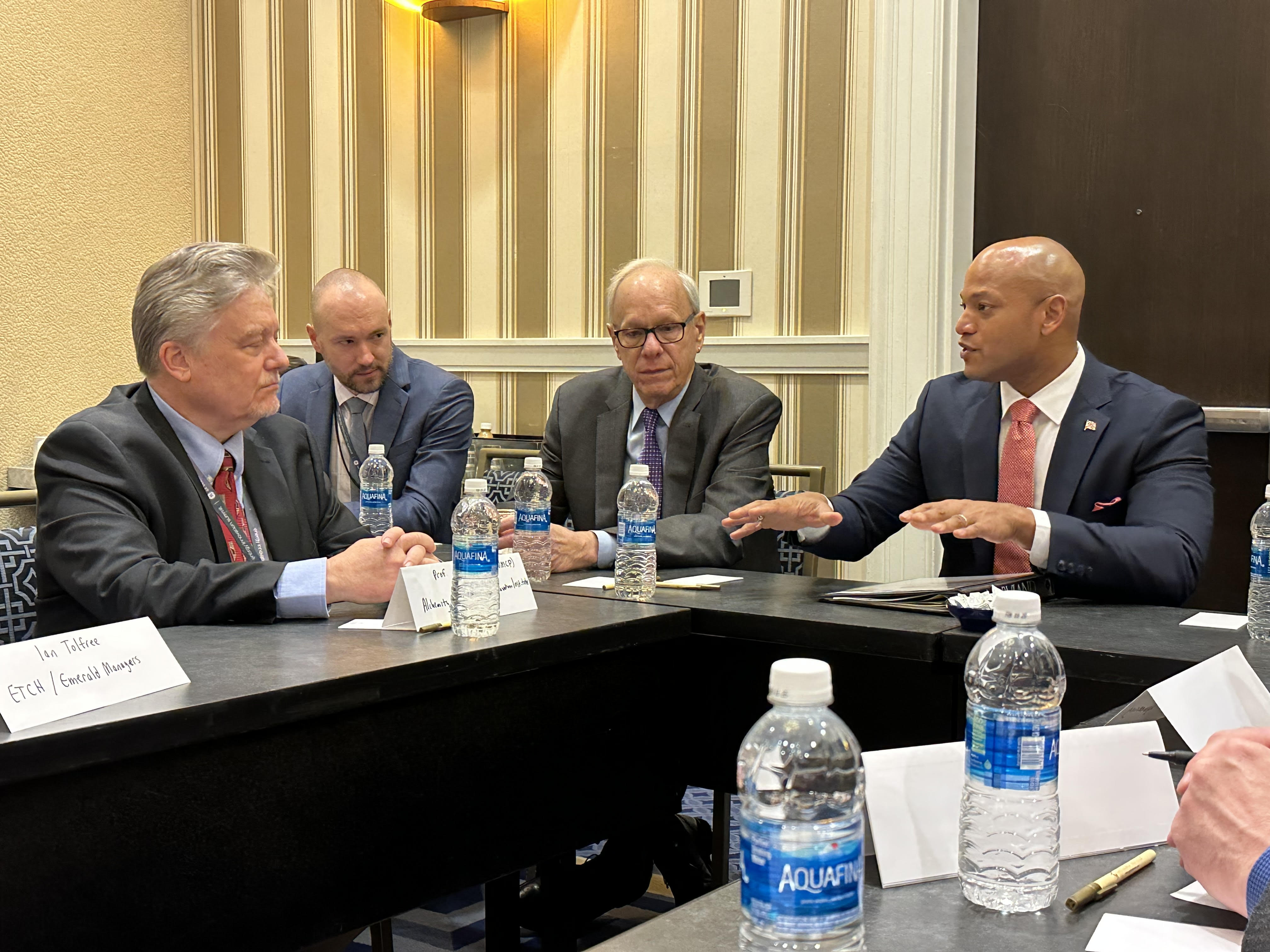 Pictured: (Left to right at the table: Dr. Eric Wachsman (Director, MEI2), Paul Pinsky (Director, Maryland Energy Administration), Maryland Governor Wes Moore.