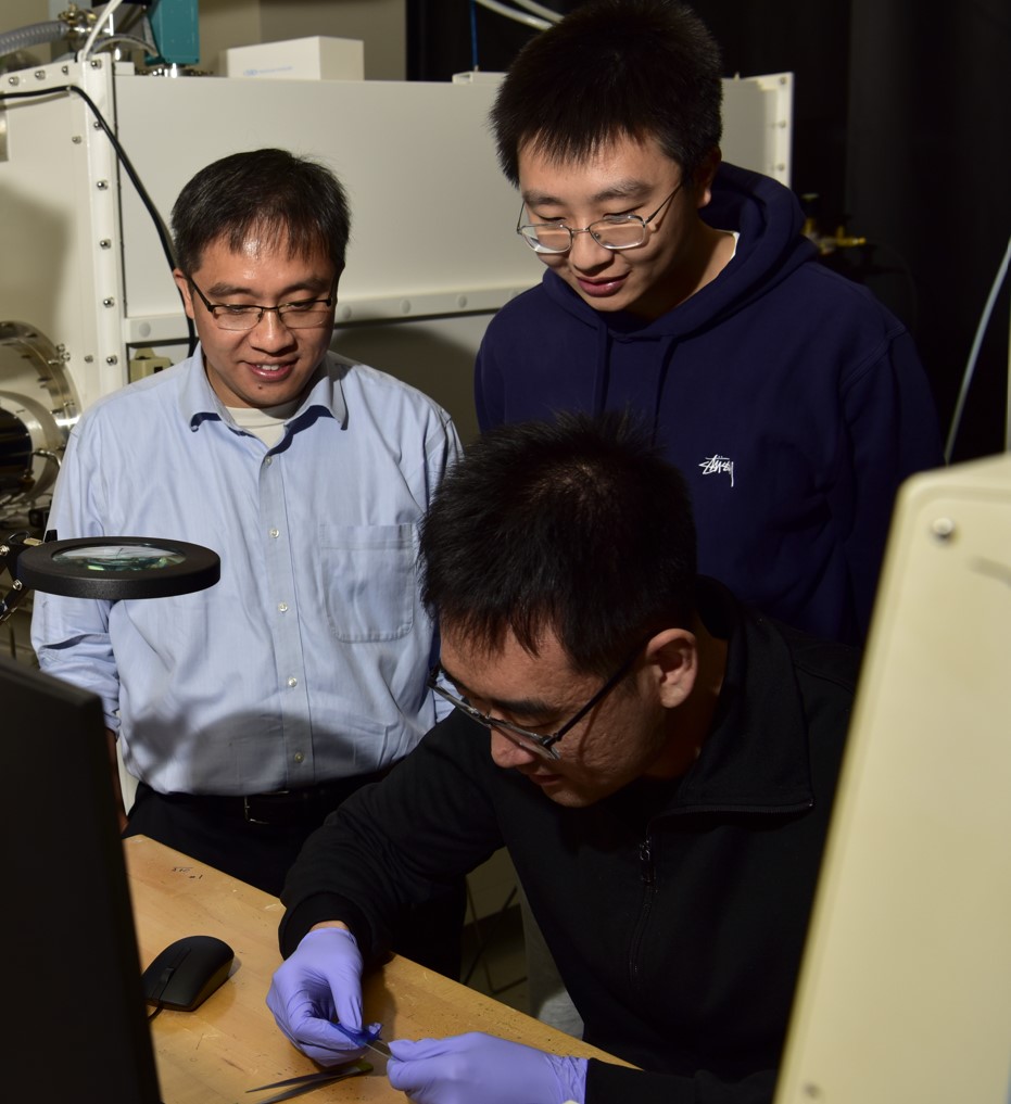 Standing left and right: Prof. Cheng Gong and Ti Xie Sitting: Shanchuan Liang.