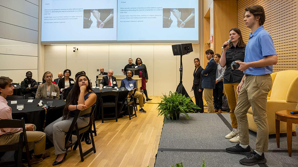 Zoe Poppert and William Meagher present their first-place Internet of Things device, The Guardian, in A. James Clark Hall during Northrop Grumman Day. Photo by Stephanie S. Cordle