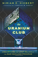 cover of The Uranium Club by Miriam E. Hiebert featuring a glowing cube on a dark background
