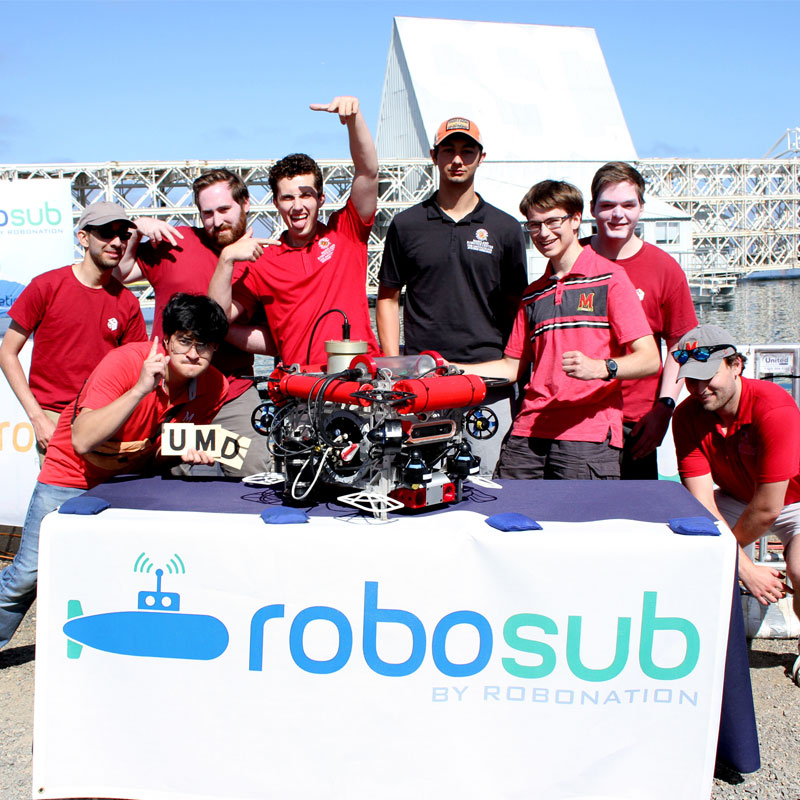 RoboSub team members at competition in Sand Diego this year, from left to right: Ishaan Ghosh (Computer Science), Manny Gancayco (Mechanical Engineering); Erik Chapman (Electrical Engineering); Dillon Capalongo (Mechanical Engineering);  Drew Weller (Electrical Engineering); Alex Yelovich (Computer Science and Math);  Jeffrey Fisher (Computer Science) and Josh Smith (Computer Science).