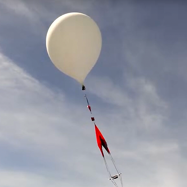 A balloon launched by UMD Nearspace rises into the sky on Monday, April 8.